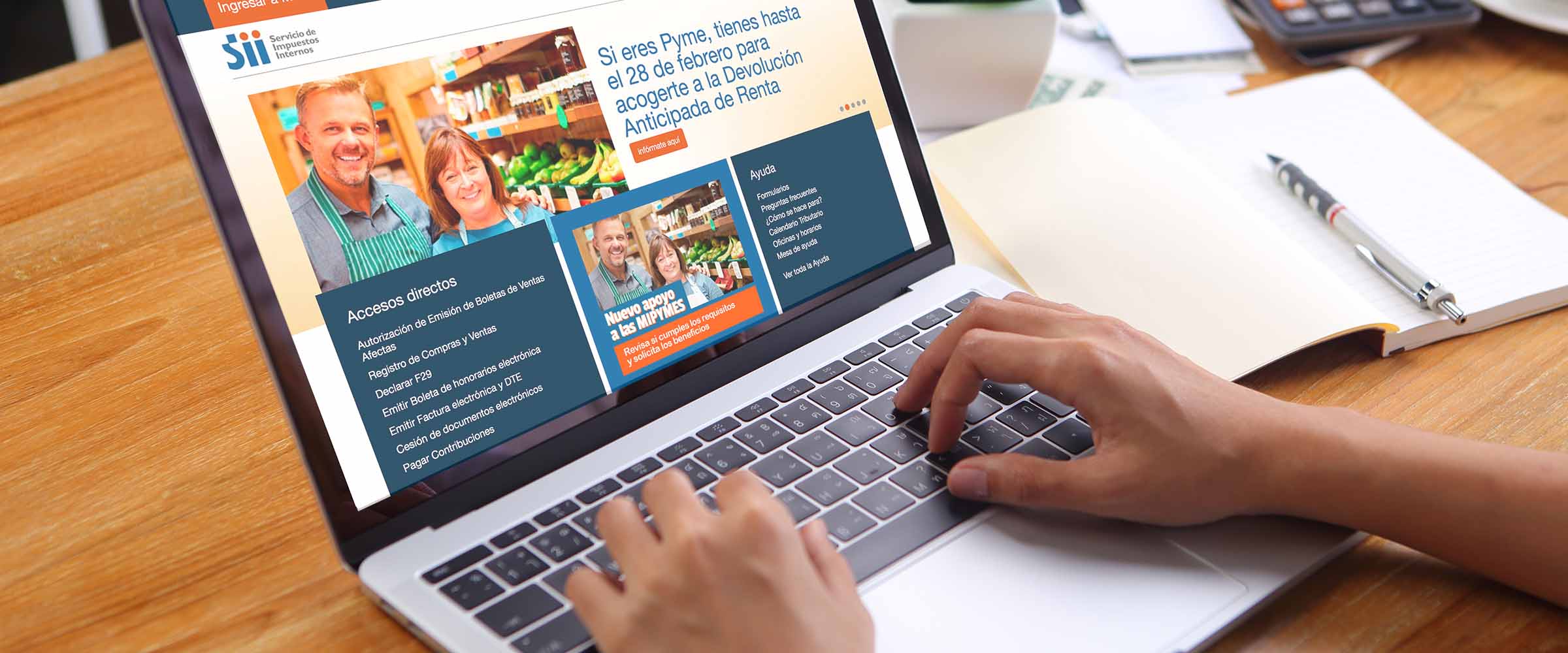 Businesswoman using mockup laptop with office stationery on wood